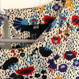 h&m floral long sleeved dress. open button back.